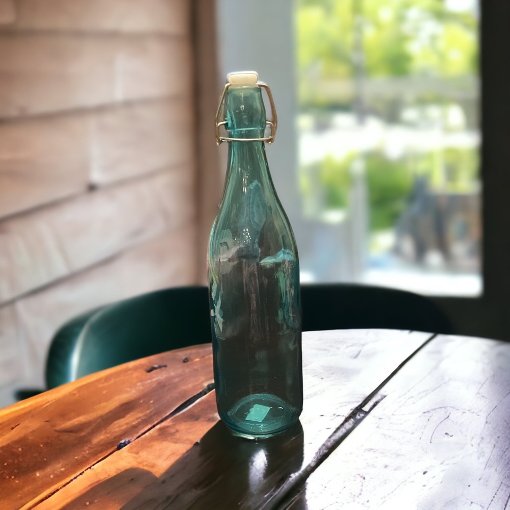 Decorative Blue Glass Bottle 12” tall x 3” wide. Not intended for food or drink.